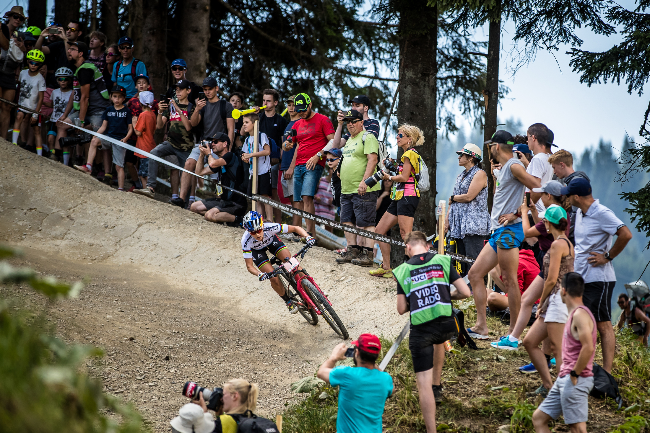 Kate Courtney cruises through a berm, giving the lungs a quick break.
